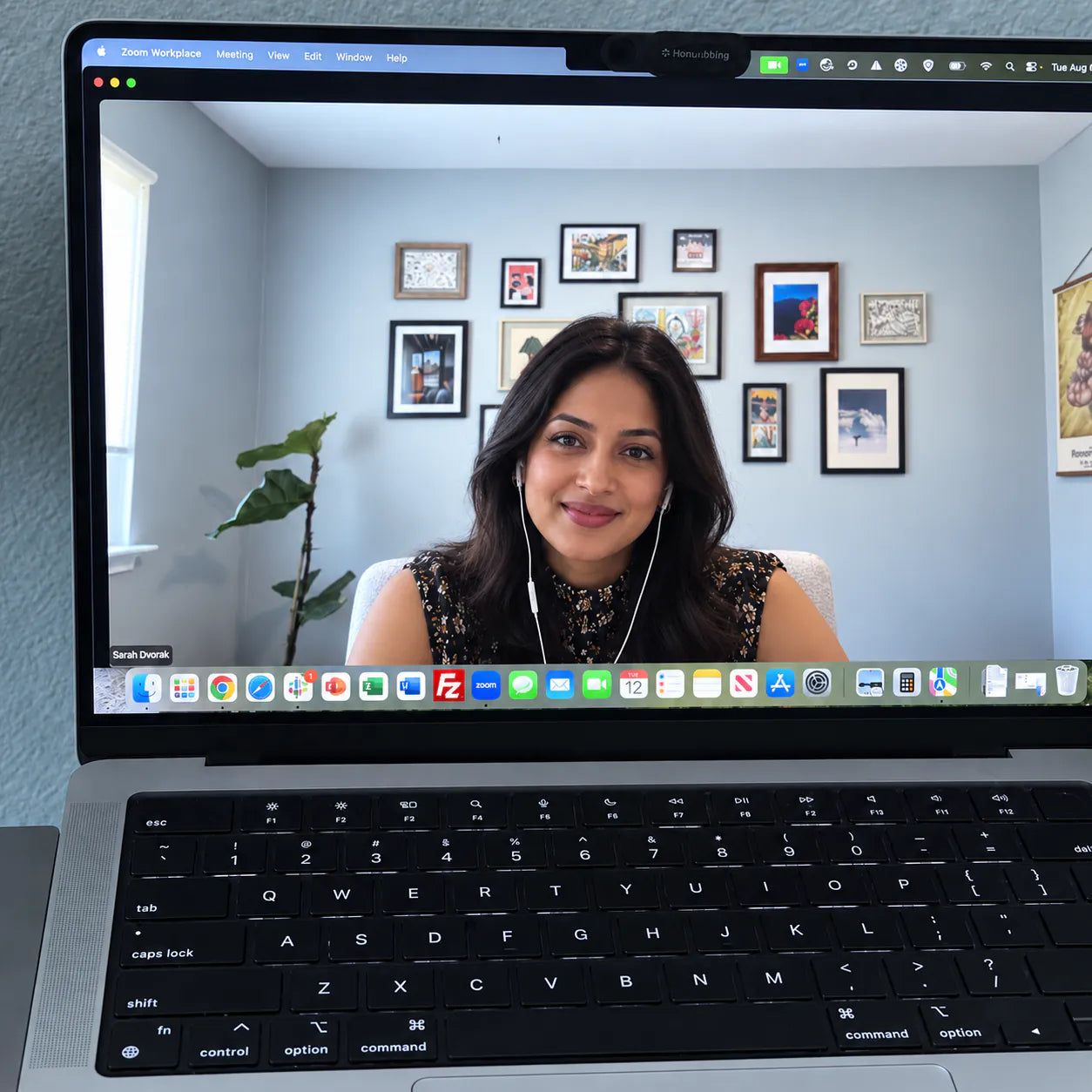 A laptop showing a video call with a member of the Sleepcation team